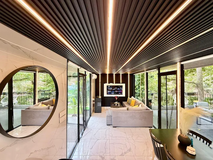 The Main House at Tranquil Experience - modern architecture with slatted ceiling and marble floors