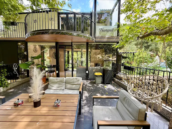 Outdoor terrace with lounge seating and Tranquil signage